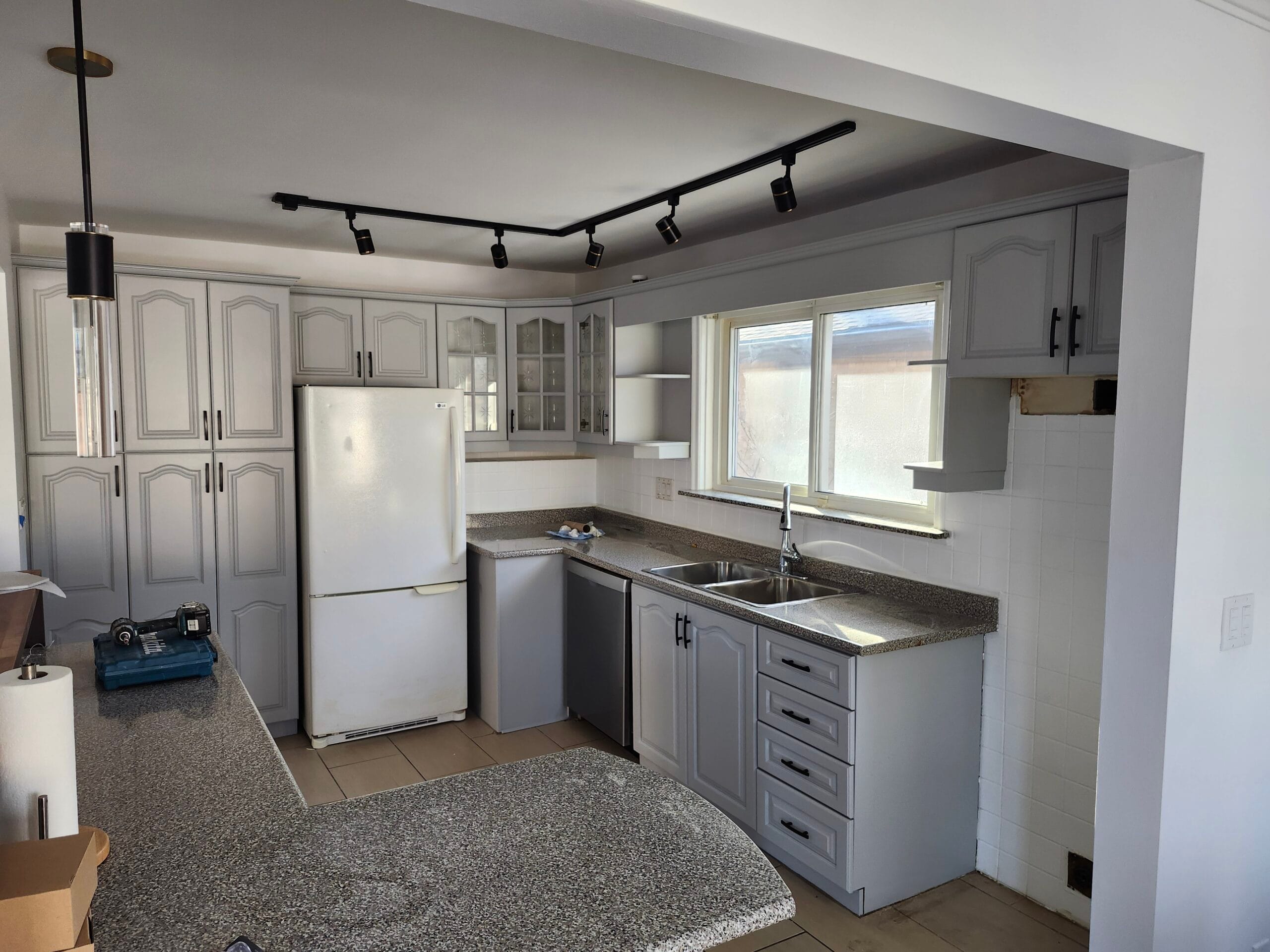 Kitchen renovation with grey cabinets and countertops Toronto – MT Renovations